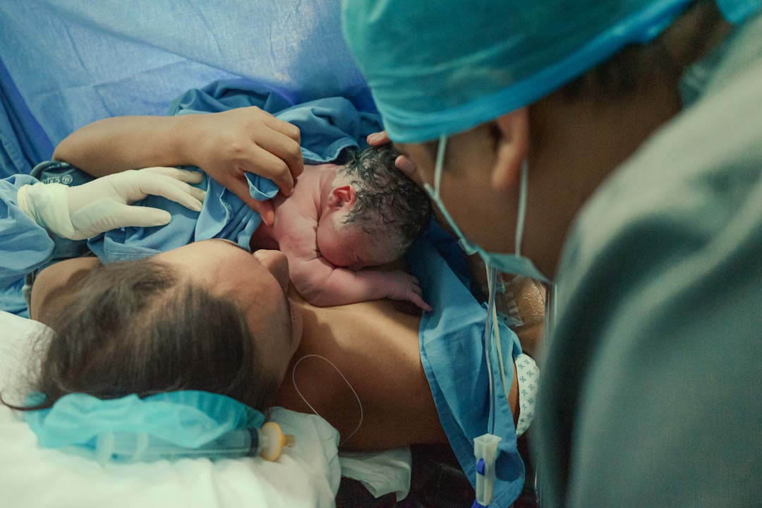 Mother holding newborn baby after birth