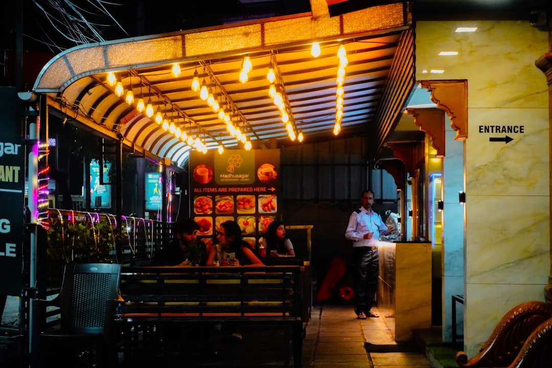Restaurant entrance with warm string lights at night